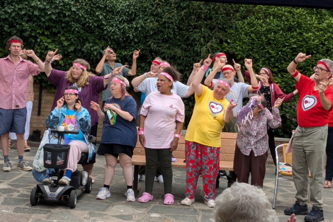 GOLD group in the Foresters Hall garden singing
