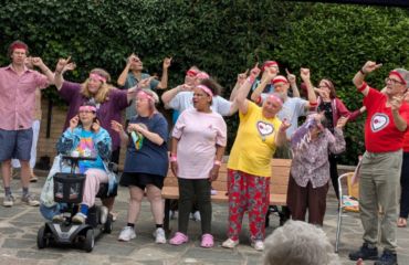 GOLD group in the Foresters Hall garden singing