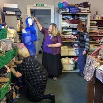 Fiona, Nicola and Elizabeth arrange displays at The ScrapStore