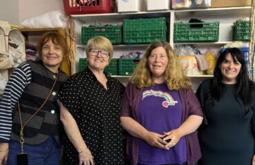 Elizabeth, Fiona, Nicola and Leonora in The ScrapStore smiling to camera