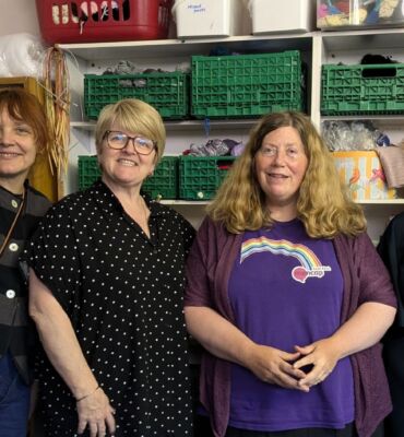 Elizabeth, Fiona, Nicola and Leonora in The ScrapStore smiling to camera