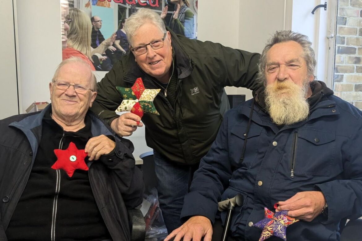 Rogan, Kevin and Ted holding their festive stars